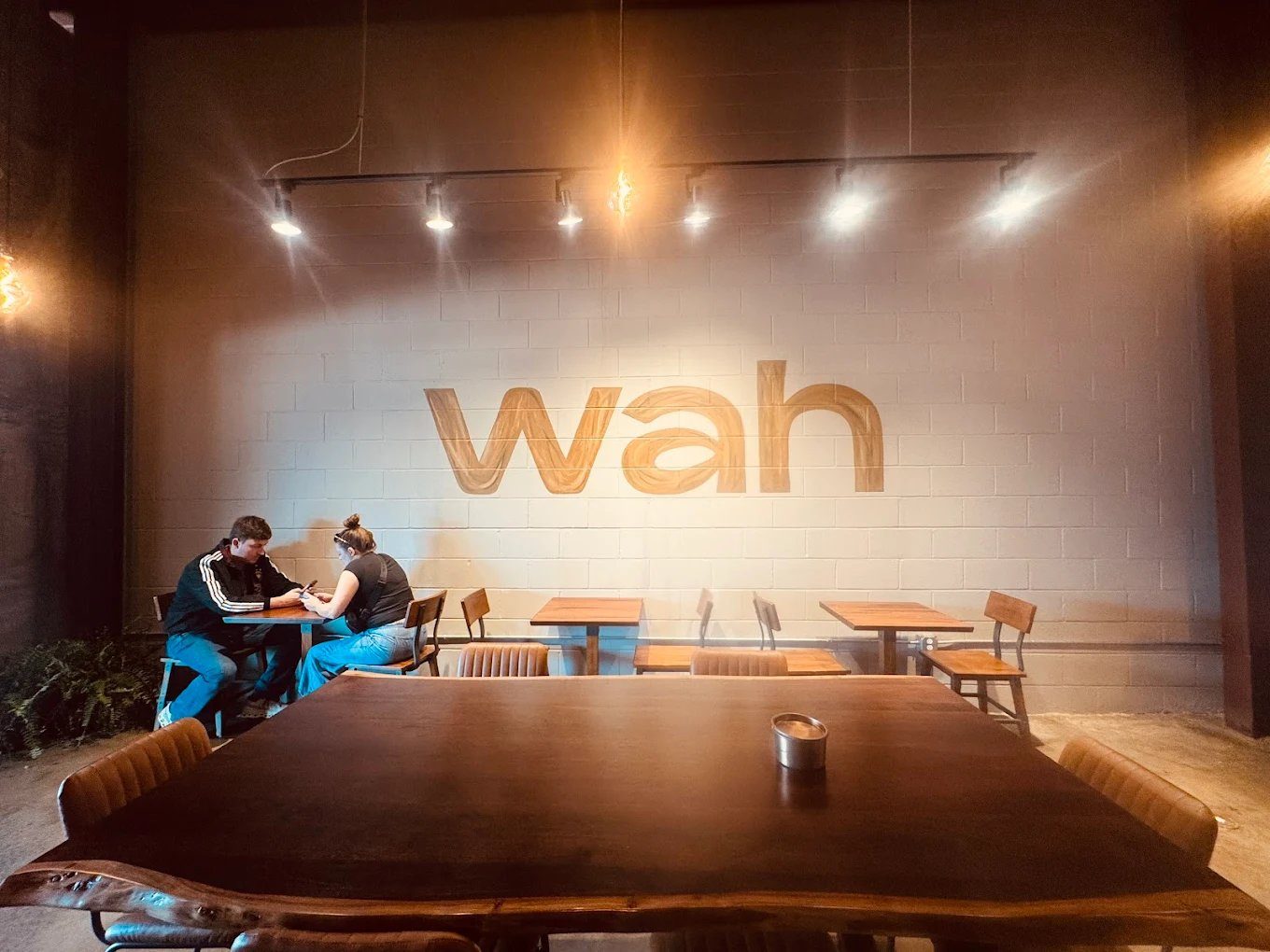 Wah Coffee — dining room with mural