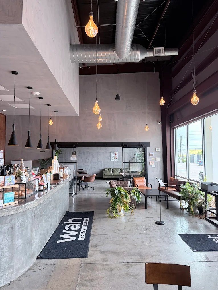 Bar and lounge area with ductwork ceiling and floor mat